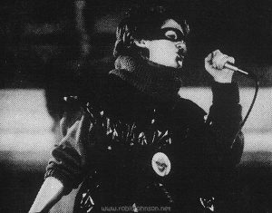 The third image from the strip across the top of the picture sleeve for RSO promotional record TS1, six songs from the "Times Square" soundtrack album, showing Nicky during the concert in Times Square. [This digital surrogate created by Sean Rockoff for robinjohnson.net.]