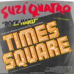 The front of the picture sleeve for the single "Rock Hard," cross-promoted by Dreamland and RSO Records, from the Suzi Quatro "Rock Hard" promo pack, 1980. Text: DL-104 SUZI QUATRO "ROCK HARD" FROM THE ORIGINAL MOTION PICTURE SOUNDTRACK TIMES SQUARE ™ A ROBERT STIGWOOD PRODUCTION B/W "STATE OF MIND" ©℗ 1980 DREAMLAND RECORDS, INC. MANUFACTURED AND MARKETED BY RSO RECORDS, INC. DISTRIBUTED BY POLYGRAM DISTRIBUTION, INC. 810 7TH AVENUE, NEW YORK, NEW YORK 10019. ALL RIGHTS RESERVED. PRINTED IN USA. UNAUTHORIZED DUPLICATION IS A VIOLATION OF APPLICABLE LAWS. [This digital surrogate was created by Sean Rockoff for www.robinjohnson.net.]