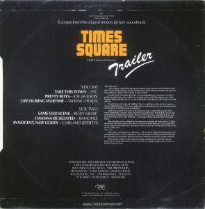 Back cover of the picture sleeve for RSO promotional record TS1, six songs from the "Times Square" soundtrack album. Text: TS1 For Promotional Use Only Not For Resale Excerpts from the original motion picture soundtrack TIMES SQUARE A Robert Stigwood Production Trailer SIDE ONE TAKE THIS TOWN-XTC PRETTY BOYS-JOE JACKSON LIFE DURING WARTIME-TALKING HEADS SIDE TWO SAME OLD SCENE - ROXY MUSIC I WANNA BE SEDATED - RAMONES INNOCENT, NOT GUILTY - GARLAND JEFFREYS About the story ... 'Times Square' depicts the adventures of two teenage runaways, New York girls from different social backgrounds, and the all night Times Square radio personality who befriends them and gives a boost to their dream of rock stardom. Pamela Pearl (Trini Alvarado) is the 13 year old daughter of a young New York City politician who has been given the job of cleaning up the seedy Times Square area. Nicky Marotta (Robin Johnson) age 16, is a street delinquent who dreams of becoming a rock and roll star. Pamela is shy and awkward, inhibited. Nicky is rebellious, with a streak of explosive energy and dark humour. They meet while both are undergoing tests at a psychiatric hospital and escape by commandeering an ambulance. Johnny La Guardia (Tim Curry) who broadcasts from a studio high atop the Allied Chemical Building, considers Times Square his personal domain. Pamela had written to him anonymously. Intrigued, he promotes the story of the runaways, urging the girls on, and turns them into minor media celebrities. It also makes things uncomfortable for Pamela's father. The girls hide out in an abandoned warehouse overlooking the Hudson River. Calling themselves The Sleaze Sisters, they dress in versions of down and outers, spray paint their sleaze slogans around the town, and inspire others to reject the smooth superficiality of the plastic culture and 'go sleaze'. They make a second home on the Deuce - the stretch of 42nd Street between Seventh and Eighth Avenues - and are adopted by the locals who