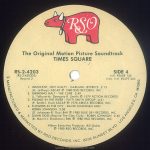 Label side 4 of 4 of the "Times Square" soundtrack album, US edition Text: The Original Motion Picture Soundtrack TIMES SQUARE RS-2-4203 (RS-2-4203DS) Record 2 SIDE 4 Intl. #2658 145 Indv. Intl. #2479 265 1. INNOCENT, NOT GUILTY - GARLAND JEFFREYS 2:13 (G. Jeffreys) ASCAP ℗ 1980 RSO RECORDS, INC 2. GRINDING HALT - THE CURE 2:49 (L. Tolhurst-M. Dempsey-R. Smith) ℗ 1979 FICTION RECORDS 3. PISSING IN THE RIVER - PATTI SMITH GROUP 4:41 (P. Smith-I. Krql) ASCAP ℗ 1976 ARISTA RECORDS, INC, 4. FLOWERS IN THE CITY - DAVID JOHANSEN AND ROBIN JOHNSON 3:58 (D. Johansen-R. Guy) BMI ℗ 1980 BLUE SKY RECORDS, INC. 5. DAMN DOG (Reprise-The Cleo Club) - ROBIN JOHNSON 2:40 (B. Mernit-J. Brackman) BMI ℗ 1980 RSO RECORDS, INC. Album Executive Producer: Bill Oakes ℗1980 RSO RECORDS, INC. 49 MANUFACTURED & MARKETED BY RSO RECORDS INC. 8335 SUSNSET BLVD., LOS ANGELES, CA. 90069