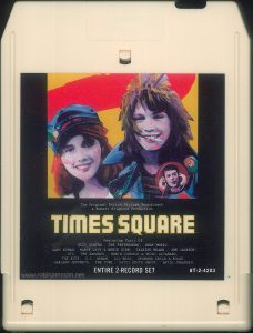 The 8-track edition of the "Times Square" soundtrack split some of the songs across its programs, and lacked most of the cover art from the LP version. Text: The Original Motion Picture Soundtrack A Robert Stigwood Production TIMES SQUARE Featuring Music Of: SUZI QUATRO, THE PRETENDERS, ROXY MUSIC, GARY NUMAN, MARCY LEVY & ROBIN GIBB, TALKING HEADS, JOE JACKSON, XTC, THE RAMONES, ROBIN JOHNSON & TRINI ALVARADO, THE RUTS, D.L. BYRON, LOU REED, DESMOND CHILD & ROUGE, GARLAND JEFFREYS, THE CURE, PATTI SMITH GROUP, DAVID JOHANSEN. ENTIRE 2-RECORD SET 8T-2-4203