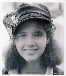 Black and white photograph of Trini Alvarado as Pamela Pearl in TIMES SQAURE (1980) Text (on front): TS-11-24/5 (on back): MUST RETURN RUNAWAY REBEL She's the troubled daughter of an ambitious politician who is so upset that she becomes a runaway rebel. This is TRINI ALVARADO's role in the new film called, "Times Square". The major role follows her remarkable debut success in the picture "Rich Kids". (AB) HO CREDIT BANDPHOTO ALAN BAND ASSOCIATES 25 LONGDOWN ROAD FARNHAM, SURREY, ENGLAND