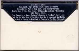 The USA edition of the cassette version of the "Times Square" soundtrack.
Case back, with insert.
Text:
SIDE ONE / 34:55
Rock Hard / Talk Of The Town / Same Old Scene
Down In The Park / Help Me! / Life During Wartime
Pretty Boys / Take This Town / I Wanna Be Sedated / Damn Dog
SIDE TWO / 31:05
Your Daughter Is One / Babylon's Burning / You Can’t Hurry Love
alk On The Wild Side / The Night Was Not / Innocent, Not Guilty
ng Halt / Pissing In The River / Flowers In The City / Damn D