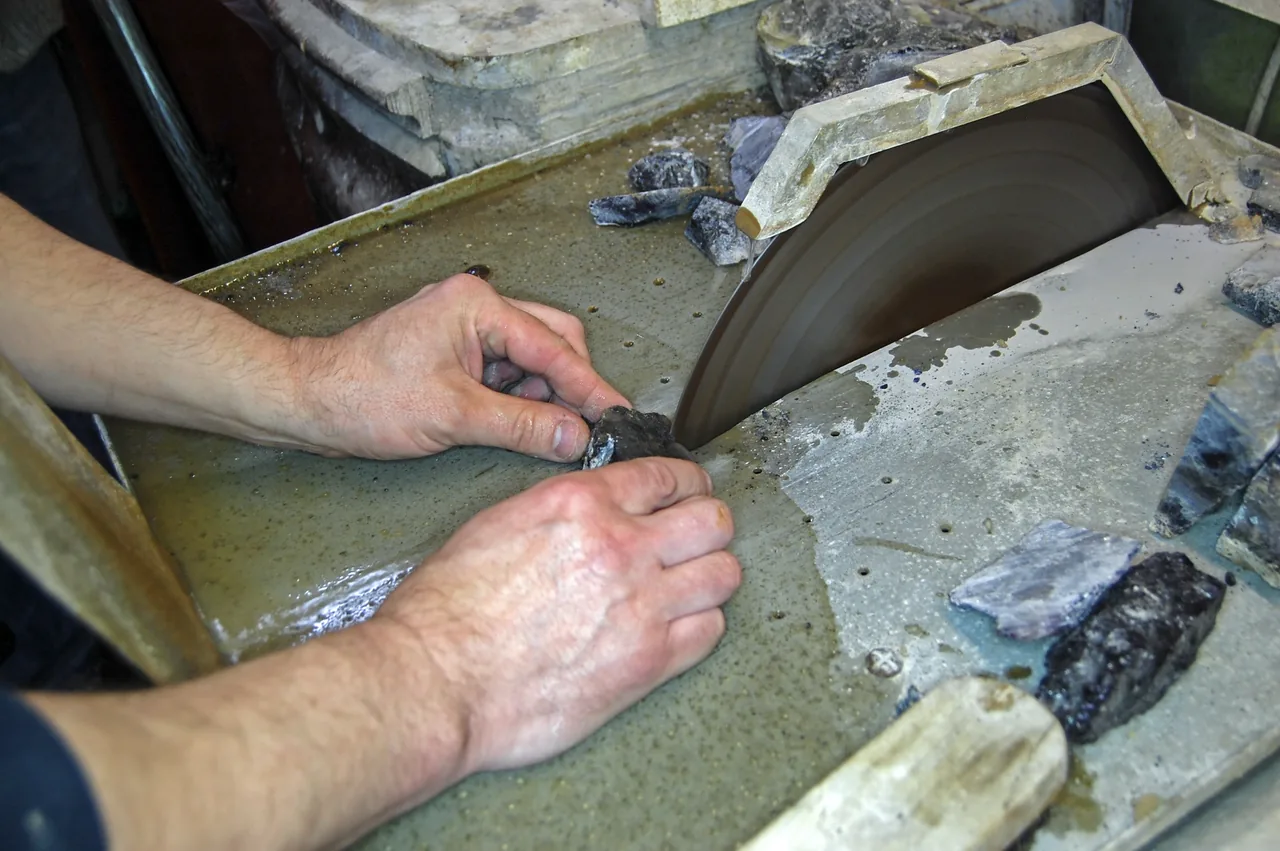 Sawing Blue John fluorite at Treak Cliff Cavern, Derbyshire.