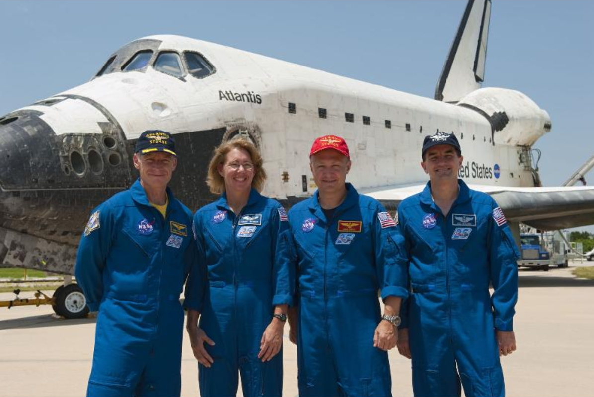 The STS-135 crew members pause for a final photograph in front of Space Shuttle Atlantis after an employee appreciation event held at Orbiter Processing Facility-2 at NASA's Kennedy Space Center in Florida. Seen here are Commander Chris Ferguson (left), Mission Specialist Sandy Magnus, Pilot Doug Hurley and Mission Specialist Rex Walheim. Credits: NASA