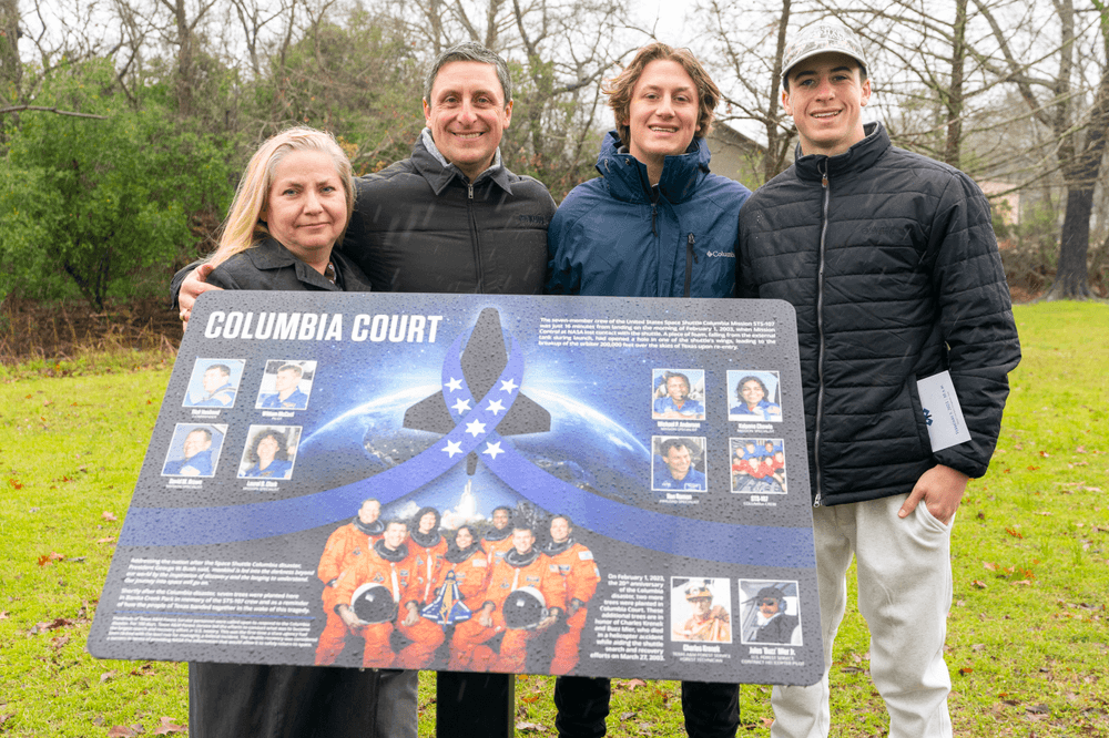 Donna Shafer, Associate Director of the NASA Johnson Space Center, from left, Al Davis, Interim Director of the Texas A&M Forest Service, Mark Krenek, son of Charles Krenek, who died in the search and recovery efforts, and Kimpton Cooper, Forest Supervisor for the National Forest and Grasslands in Texas, pose with a memorial marker remembering the Columbia Disaster. Credits: Michael Miller/Texas A&M AgriLife Marketing and Communications
