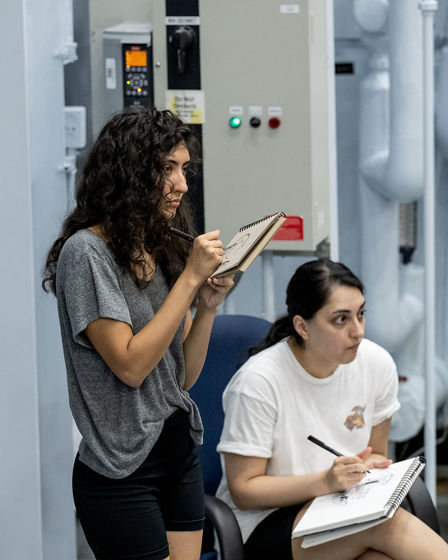 Two women sketch at NASA