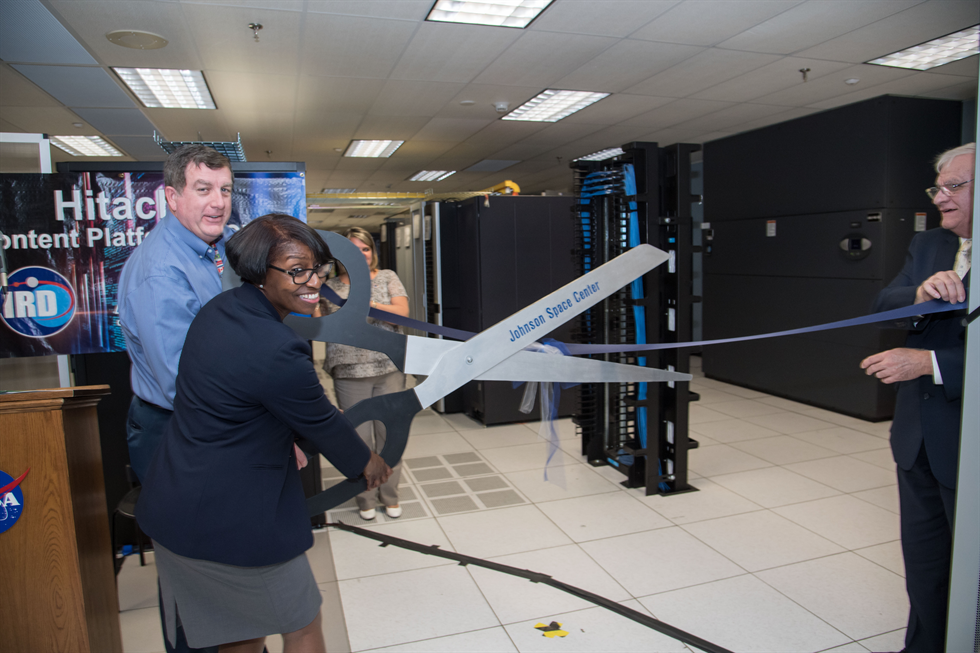 Kirk Shireman, ISS Program Manager and Annette Moore, IRD Director and JSC Chief Information Officer cut the ribbon at the Hitachi Content Platform Ribbon Cutting 