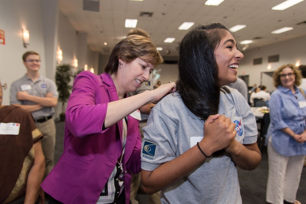 Dr. Ellen Ochoa signs a HAS student participant’s shirt during the closing ceremony of the program.