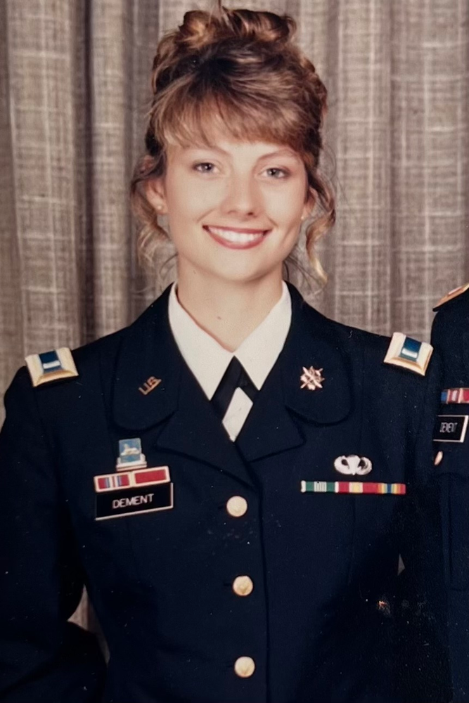 A women wearing a dress uniform for the National Guard.