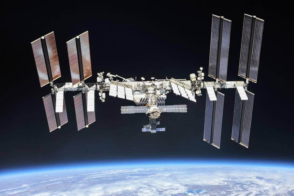 The International Space Station as it appeared in 2018. Zarya is visible at the center of the complex, identifiable by its partially retracted solar arrays. Image Credit: NASA