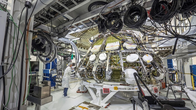 Orion’s Exploration Mission-1 crew module sits in the assembly fixture at the Neil Armstrong Operations and Checkout Building at NASA’s Kennedy Space Center in Florida. Image Credit: NASA