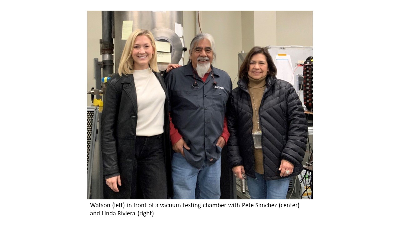 Watson (left) in front of vacuum testing chamber with Pete Sanchez (center) and Linda Riviera (right)