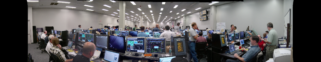 here’s a picture of the STS-114 Mission Evaluation Room.  The back row (closest to the camera) is the combined OBSS inspection team.  I’m the almost bald head to the left of center in that back row.  After Columbia crashed, I led the team working on the sensors on the end of the boom to examine the wing leading edge and tiles for damage so we didn’t have a repeat occurrence.  My, how time flies.