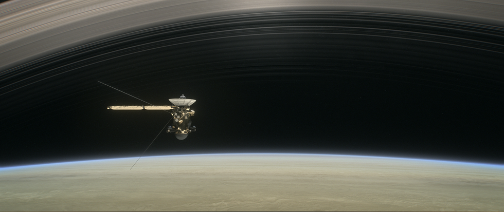 This artist's rendering shows Cassini as the spacecraft makes one of its final five dives through Saturn's upper atmosphere in August and September 2017.