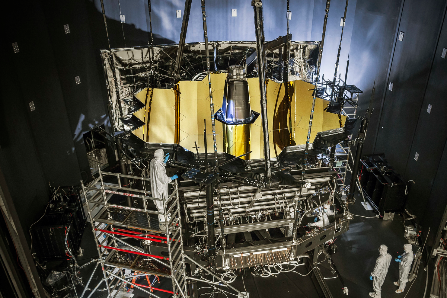 Engineers inspect NASA’s James Webb Space Telescope as it sits inside Chamber A at the Johnson Space Center in Houston, Texas. Webb completed its final cryogenic testing inside that chamber on Nov. 18, 2017. Credits: NASA/Chris Gunn