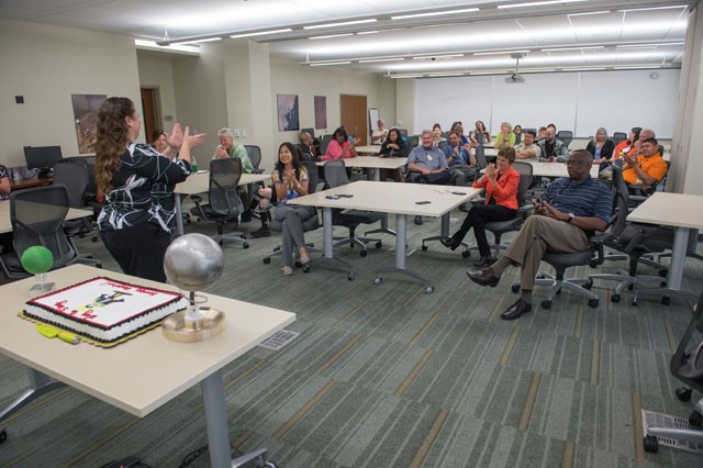 JSC Green Team member Jennifer Morrison congratulates JSC employees for winning the 2016 Energy Competition. Building 12 won for the mall area, and Building 321 for the outlying area. Image Credit: NASA/Lauren Harnett