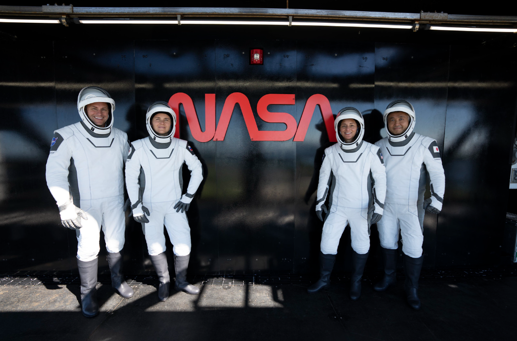 NASA’s SpaceX Crew-5 astronauts are photographed in front of the agency’s iconic worm logo at Launch Complex 39A during a countdown dress rehearsal on Oct. 2, 2022, at NASA’s Kennedy Space Center in Florida. From left are NASA astronaut Josh Cassada, pilot; Roscosmos cosmonaut Anna Kikina, mission specialist; NASA astronaut Nicole Mann, commander; and Japan Aerospace Exploration Agency astronaut Koichi Wakata, mission specialist. Credits: SpaceX