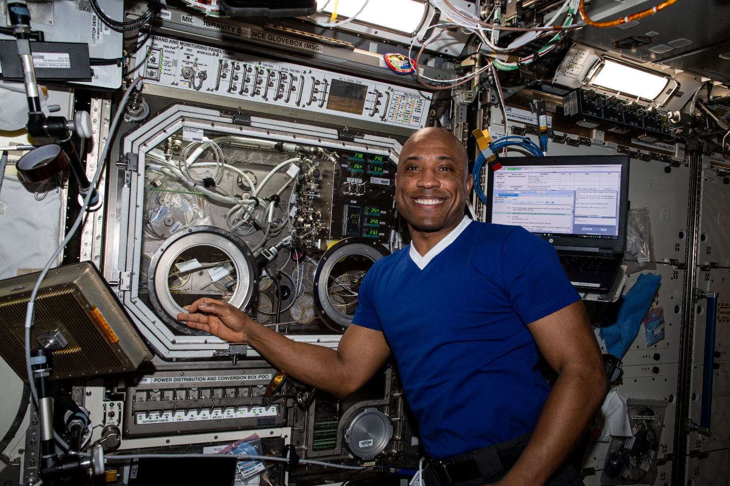NASA astronaut Victor Glover works with a payload inside the Microgravity Science Glovebox aboard the International Space Station in 2021. Credits: NASA