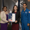 Woman receiving an award.