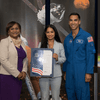 Woman receiving an award.