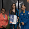 Woman receiving an award.