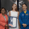 Woman receiving an award.