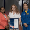 Woman receiving an award.