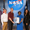 Group of people receiving an award