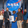 Group of people receiving an award