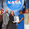 Group of people receiving an award