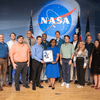 Group of people receiving an award.