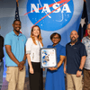 Group of people receiving an award