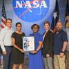 Group of people receiving an award