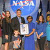 Group of people receiving an award