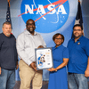 Group of people receiving an award