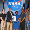 Group of people receiving an award