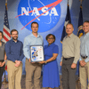 Group of people receiving an award