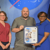 Man and woman receiving an award