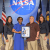 Group of people receiving an award