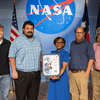 Group of people receiving an award