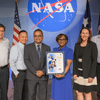 Group of people receiving an award