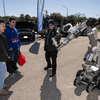 Groups of people enjoy a variety of indoor and outdoor exhibits and displays during a safety and health fair.