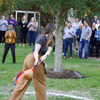 A group of people gathered outside on the lawn during a turkey launch. 