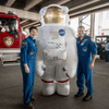 Photos of children and their families enjoying a holiday event that featured NASA astronauts and activities.