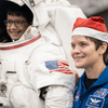 Photos of children and their families enjoying a holiday event that featured NASA astronauts and activities.