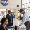 Photos of people in professional attire participating in a Black History Month program.