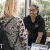 Photos of people in professional attire participating in a Black History Month program.