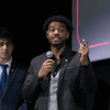 Students give a presentation on the stage in an auditorium. 