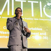 Students give a presentation on the stage in an auditorium. 